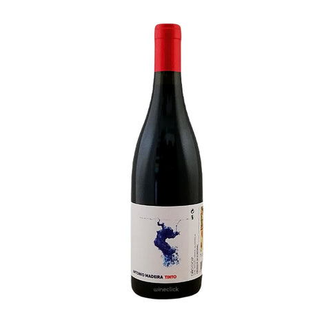 A bottle of dark red wine with a red capsule and a white label featuring a blue abstract graphic and the text 'ANTONIO MADERA TINTO'.