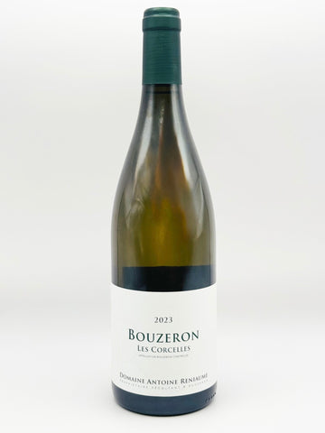 A bottle of Domaine Antoine Rinaldus Bouzeron Les Corcelles white wine, featuring a dark green glass bottle, a white paper label with black text, and a dark green capsule seal, set against a plain light gray background.
