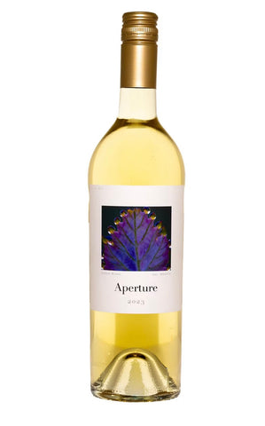 A bottle of Aperture 2023 white wine with a white label featuring a purple and blue floral graphic, a gold foil neck, and a gold screw cap, set against a plain white background.