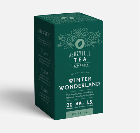 A box of Asheville Tea Company Winter Wonderland white tea, shown at a three-quarter angle on a light gray background.
