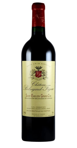 A bottle of Château Pibouillard-Fignon Saint Emilion Grand Cru red wine, featuring a dark glass bottle, a cream-colored label with a red crest, and a red foil-wrapped neck, set against a plain white background.