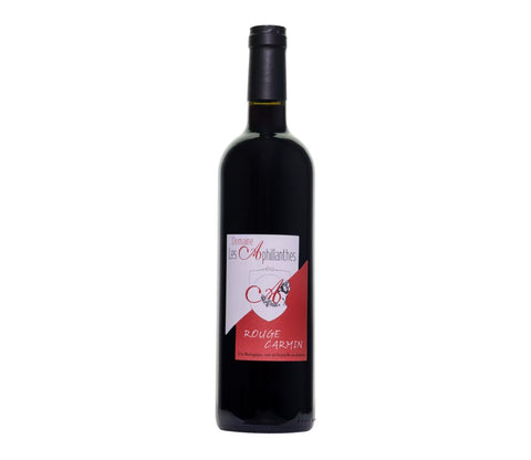 A bottle of red wine with a black glass body, black cap, and a label featuring red, white, and black colors, set against a plain white background.