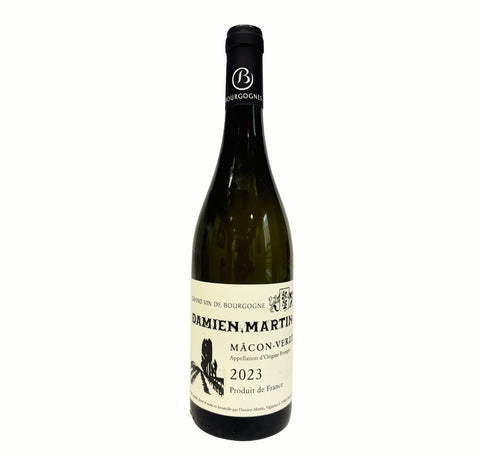 A bottle of Damien Martin Mâcon 2023, in a dark green glass bottle with a cream-colored label and a black foil capsule.