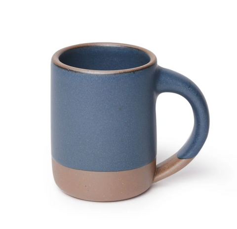 Blue ceramic mug with a brown base on a white background