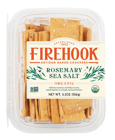 A clear plastic clamshell package of Firehook Organic Rosemary Sea Salt artisan baked crackers, showing the golden-brown crackers inside with a cream label featuring red and green text.
