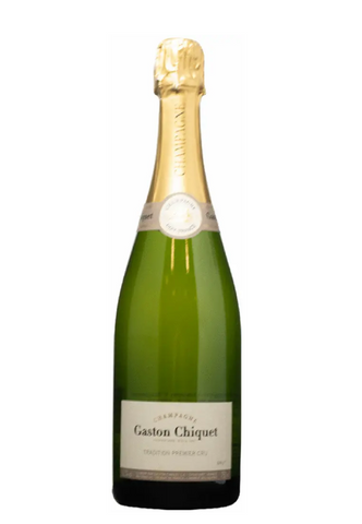 Green champagne bottle with gold foil cap on a white background