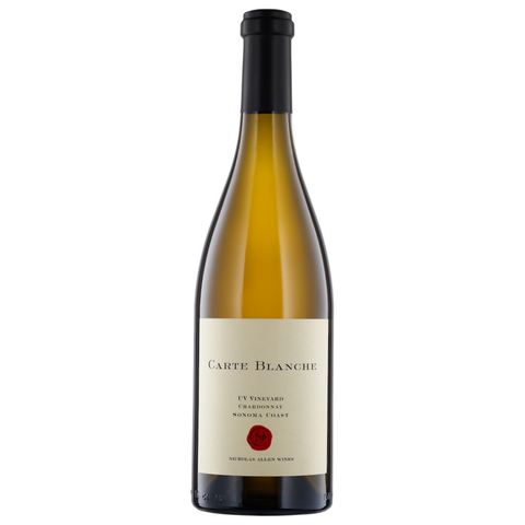 A bottle of Carte Blanche white wine on a plain white background. The bottle is made of dark glass showing the golden-amber liquid inside, has a cream-colored label with black text and a small red wax seal, and is sealed with a black capsule.