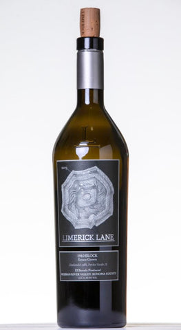 A bottle of Limerick Lane Red Block wine with a dark green glass body, a black label with a silver-gray geometric design, and a cork stopper, set against a plain white background.