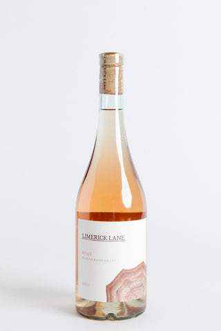 A bottle of Limerick Lane Rosé wine with a pale pink label, showcasing the wine's color.