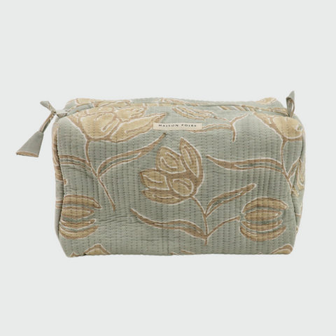 Fabric pouch with floral pattern on a light gray background
