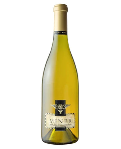 A bottle of Miner 1496 Valley Chardonnay white wine, featuring a pale golden-yellow liquid inside a clear glass bottle with a gold foil capsule and a cream-colored label.