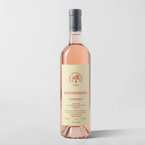 A bottle of Montenidoli Il Canaiuolo Rosato wine with a pale pink label, showcasing the Montenidoli logo and the text 'Canaiuolo Toscana IGT 2021'. The bottle is filled with a slightly pinkish rose wine.