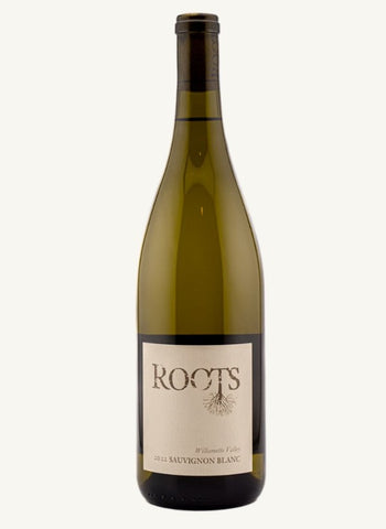 A bottle of Roots White Sauvignon Blanc wine on a solid off-white background. The bottle is made of dark olive-green glass with a cream-colored label featuring the brand name 'ROOTS' in a stylized serif font.