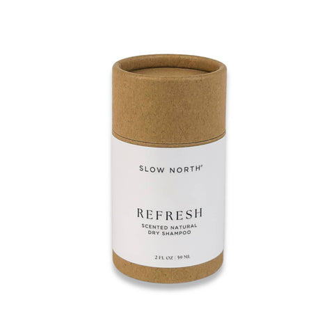 A biodegradable paperboard shaker tube labeled 'Refresh - Slow North Natural Dry Shampoo', standing upright against a white background.