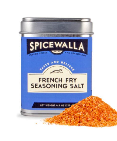 A tin of Spicewalla French Fry Seasoning Salt with a blue label and silver lid, shown next to a small pile of orange seasoning salt on a white background.
