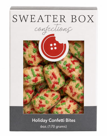 A 6 oz box of Sweater Box Confections Holiday Confetti Bites, featuring a white and dark gray box with a clear window showing the festive, sugar-coated treats inside.