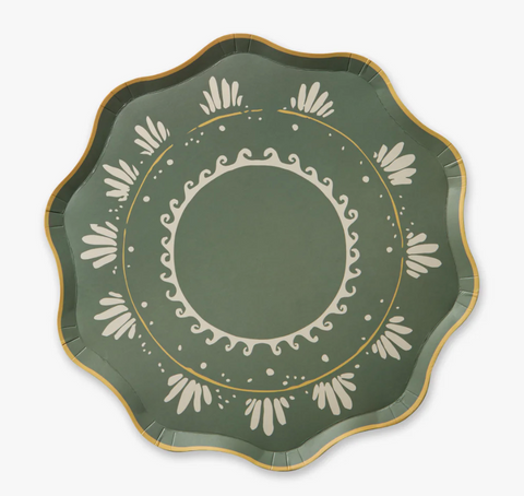 Decorative green plate with white floral patterns on a white background