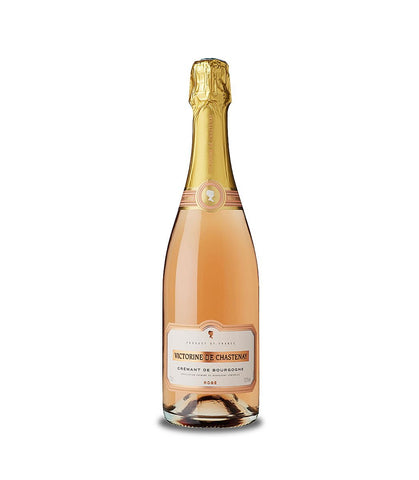 A bottle of Victorine de Chastillon Rosé Grasse sparkling wine, showing the pale pink rosé wine inside, with a gold foil-wrapped neck and a cream-colored label, set against a plain white background.