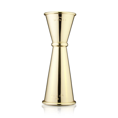 Gold jigger on a white background
