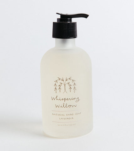 A pump bottle of Whispering Willow hand soap against a white background.