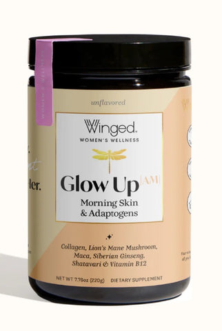 A jar of Winged Women's Wellness 'Glow Up' Morning Skin & Adaptogens dietary supplement, featuring a black lid, beige label, and a purple ribbon tag, set against a plain white background.