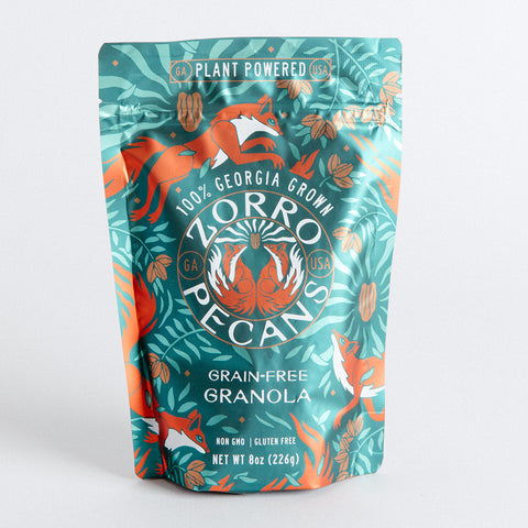 A package of Zorro Grain Free Granola featuring chopped pecans, dried blueberries, coconut, and maple syrup.